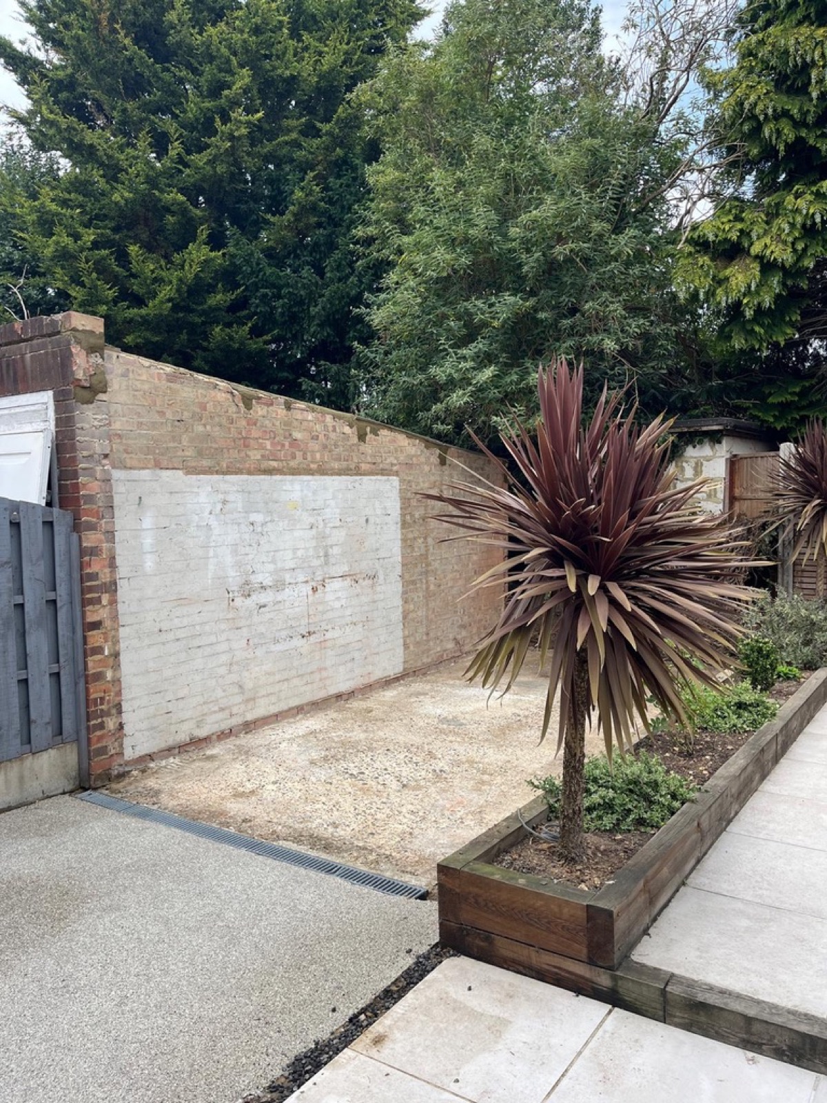 Site cleared and left level after garage demolition
