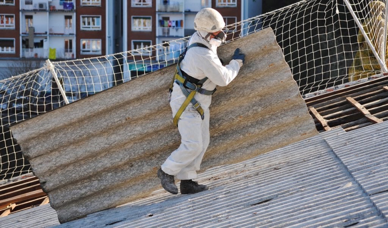 Double-wrapped asbestos cement sheets ready for licensed collection