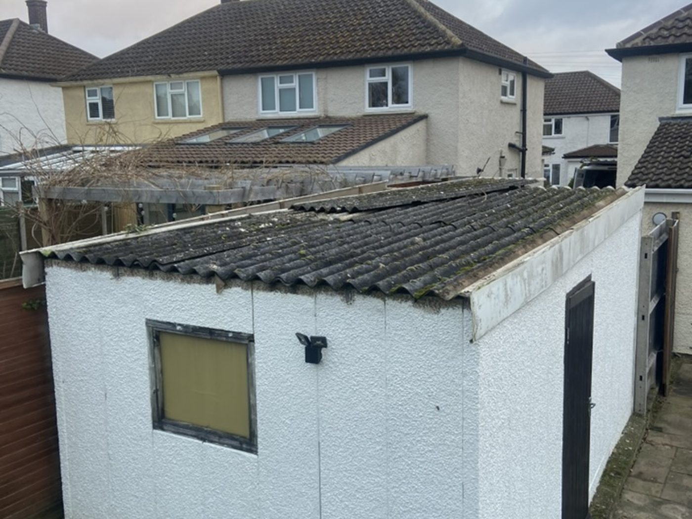 Garage roof before, old corrugated roof